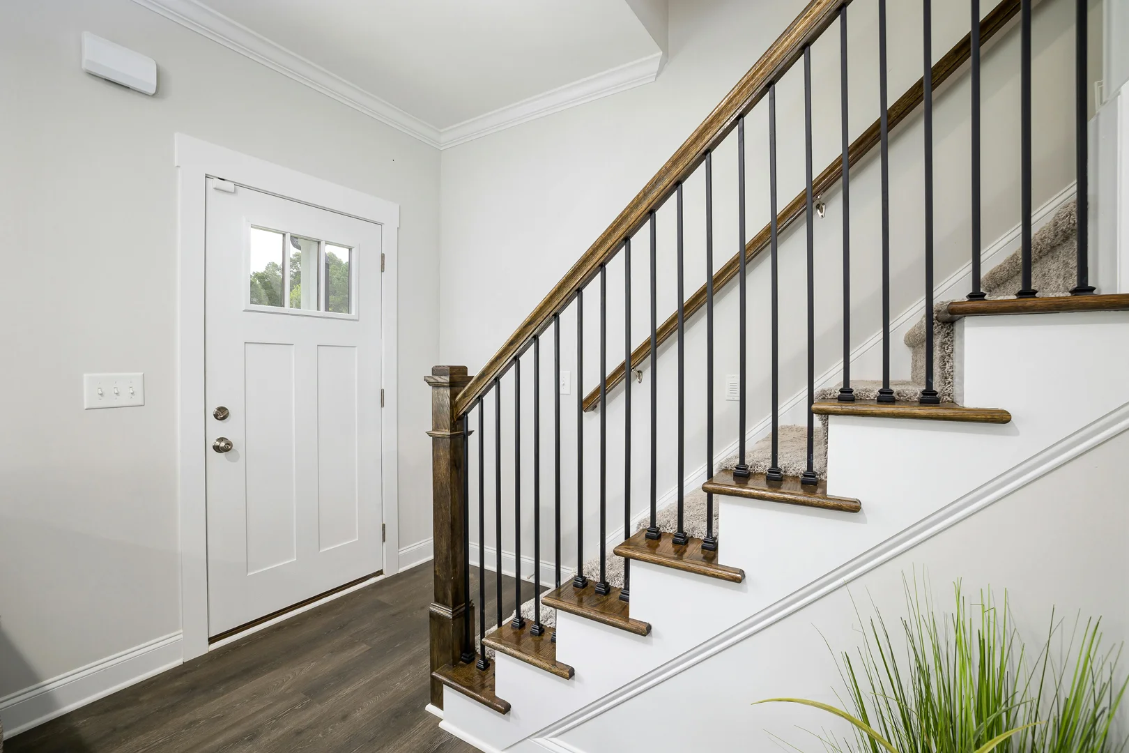 a staircase with metal railings in a house