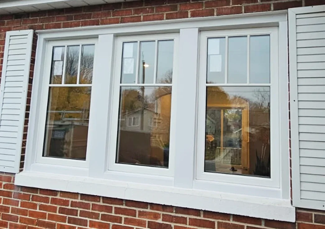 a row of windows on a brick building